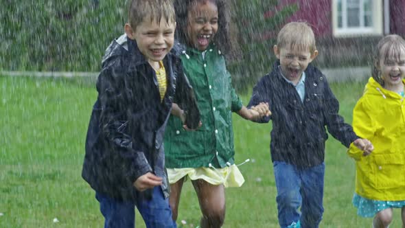 Children without Umbrellas Running in Rain