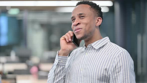 African Businessman Talking on Smartphone