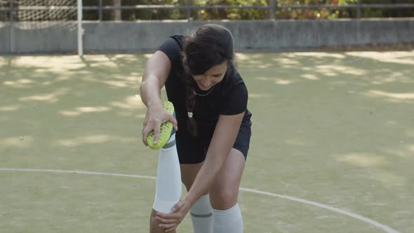 Woman Doing Exercises for Flexibility with Help of Friend