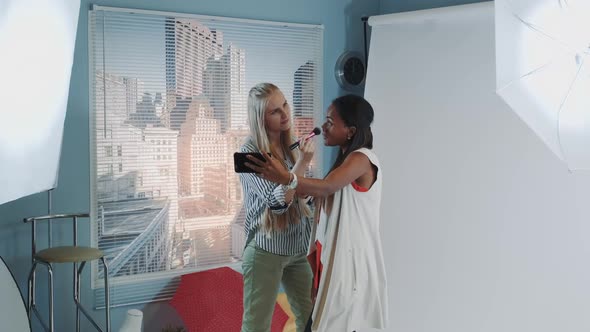 Famous Black Model Making Selfie with Make-up Artist While She Applying Makeup