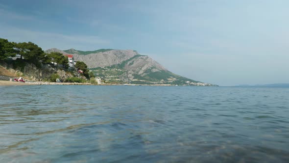 4K Cinematic nature travelling footage of a panoramic view of the cliffs and mountains of Omis next