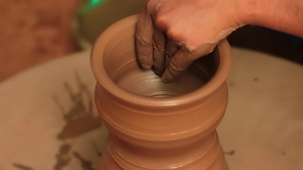 Potter at Work Makes Ceramic Dishes