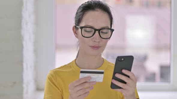 Portrait of Young Female Designer Making Online Payment on Smartphone