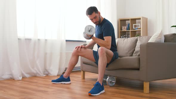 Man Exercising with Dumbbells at Home 64