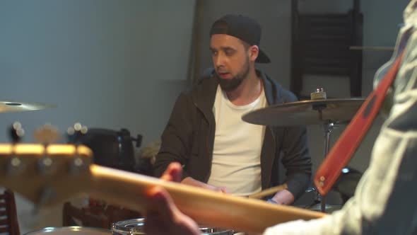 Slow Motion Drummer and His Band Play in the Garage