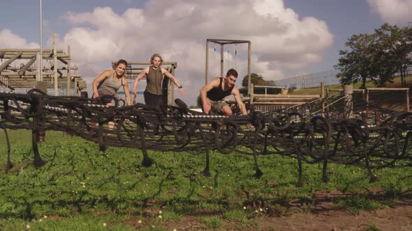 Young adults training at an outdoor gym bootcamp