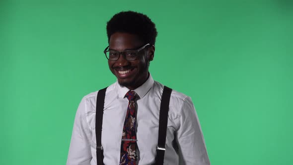 Portrait of Young African American Man Looking at Camera Smiling and Flirting