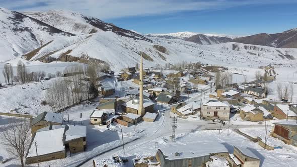 Mosque in Muslim Village in Snowy and Mountainous Valley