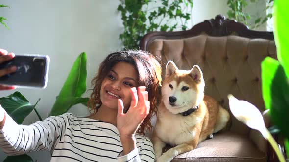 Dog and African Woman at Home Take Selfie on Phone Spbd