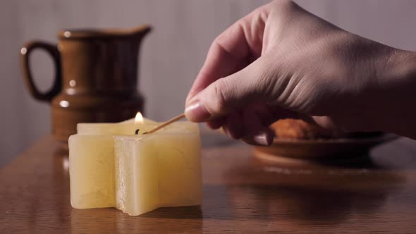 Lighting a Jewish Candle Star of David on Hanukkah