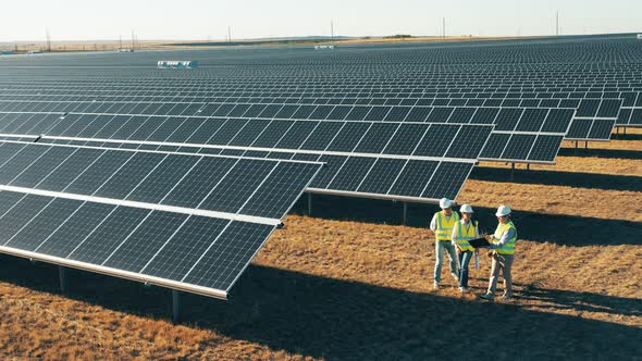 Solar Power Engineers Are Crossing a Photovoltaic Power Station