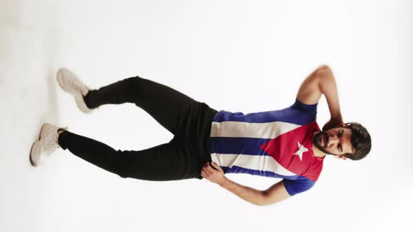 Vertical Fulllength Studio Shot of a Latin Handsome Man Wearing a Tshirt with a Cuban Flag Showing