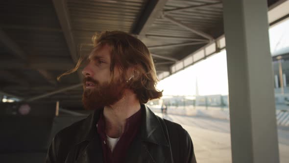 Man Listening to Music Outdoors