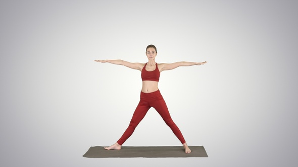 Woman practicing yoga standing in Extended Side Angle