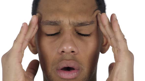 Close Up of AfroAmerican Man Face Gesturing Headache Stress