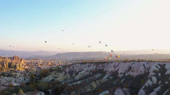 Hot Air Balloons Flying Over Mountains Landscape.