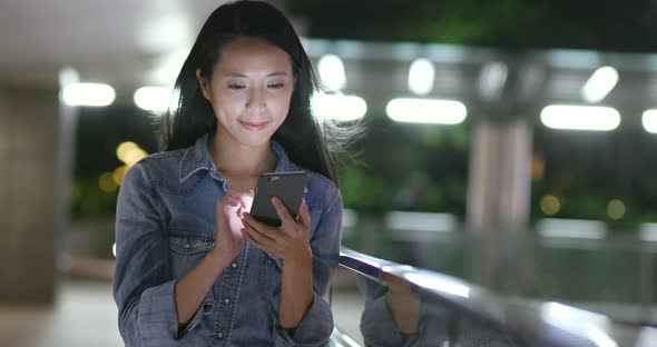 Woman use of mobile phone in street