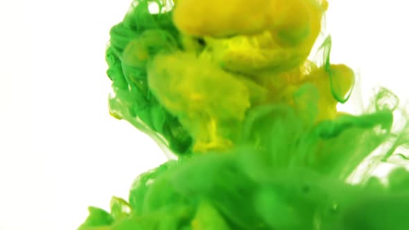 Yellow and green ink cloud motion. Color explosion