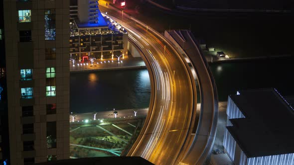 Dubai Marina Night Street Traffic Time Lapse. Pan Up