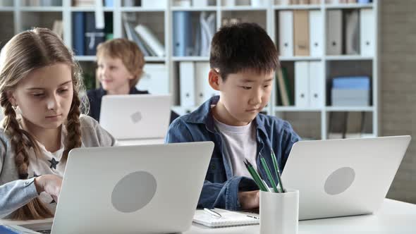 Primary Students Using Laptops