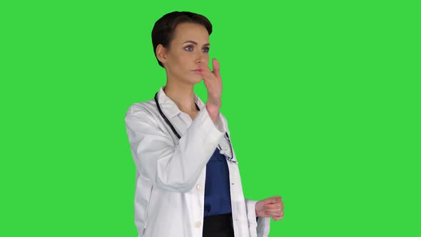 Healthcare, Medicine and Technology Concept - Smiling Female Doctor Pointing To Something