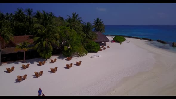 Aerial top down landscape of perfect coastline beach wildlife by turquoise sea and white sandy backg