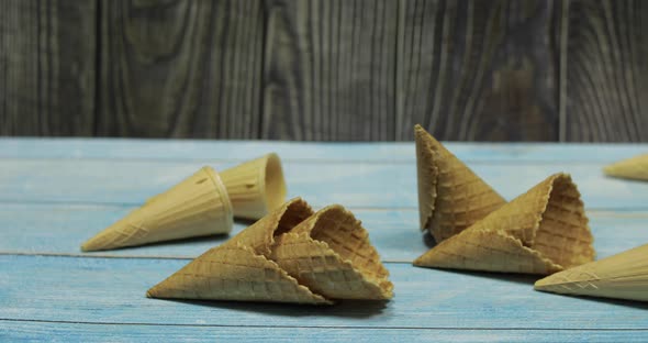 Ice Cream Cones, Isolated on Blue Wooden Surface. Waffles for Ice Cream