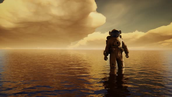Spaceman in the Sea Under Clouds at Sunset alt