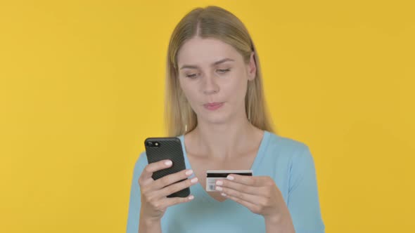 Online Payment Failure for Young Woman on Yellow Background