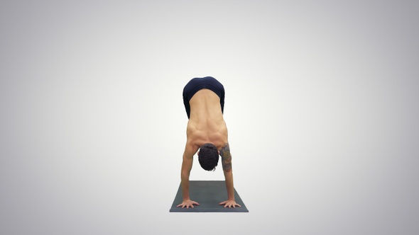 Yoga master working out doing yoga exercise downward facing