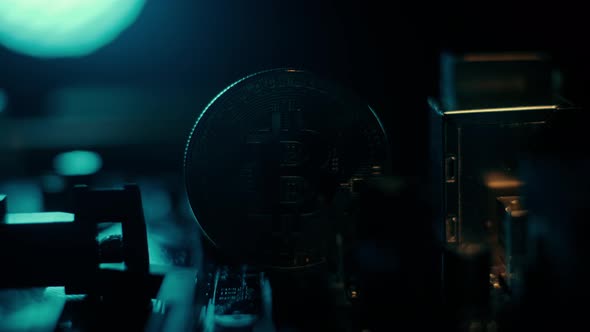 Golden Bitcoin Cryptocurrency on a Computer Board. Macro Shooting. The Concept of Cryptocurrency