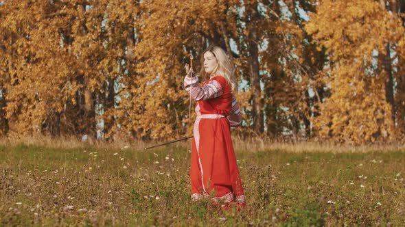 Medieval Concept - Woman in Red National Long Dress Masterfully Wields Swords