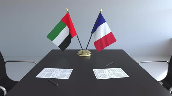 Flags of the United Arab Emirates and France on the Table alt