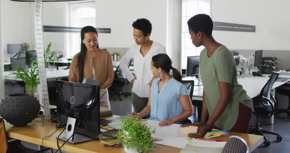 Group of diverse businesswomen working together in office