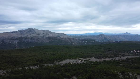 Aerial landscape shot of mountains and forest in the Dinaric Alps, Croatia