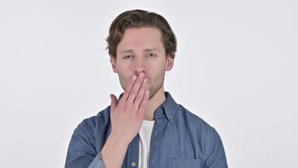 Attractive Young Man Giving Flying Kiss on White Background