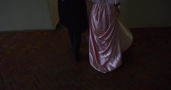 Beautiful 18Th Century Couple Is Walking in a Beautiful Palace in the Evening 