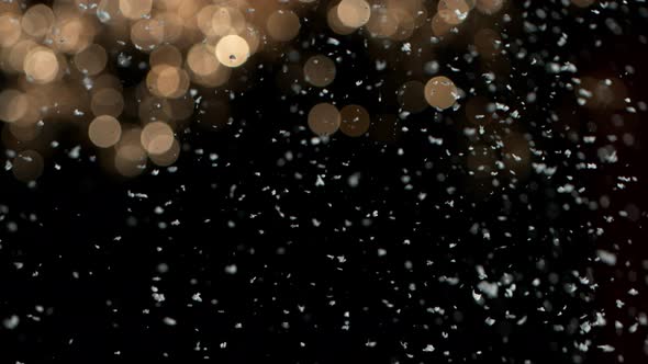 Super Slow Motion Shot of Real Snow Falling on Christmas Background at 1000 Fps
