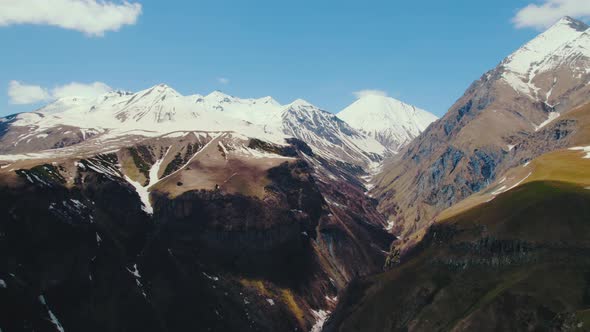 Aerial View of High and Snowy Mountains Kazbegi Georgia