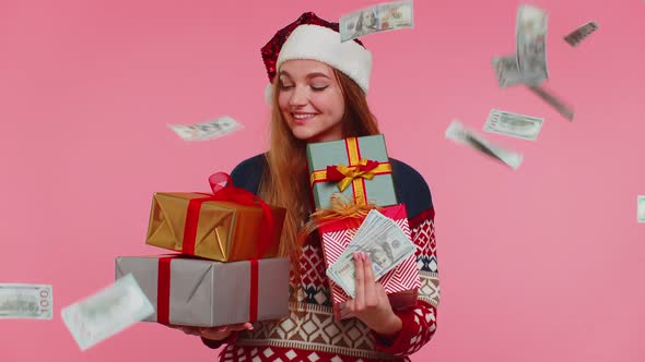 Christmas Girl Holding Gift Boxes Concept of Spending Money Shopping Online Cash Dollars Falling