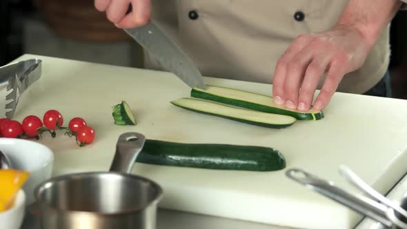 Hands Chef Cutting Zucchini