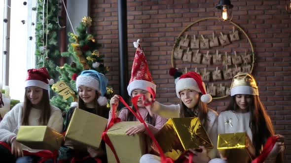 Children with New Year's gifts in their hands, celebrating Christmas and New Year