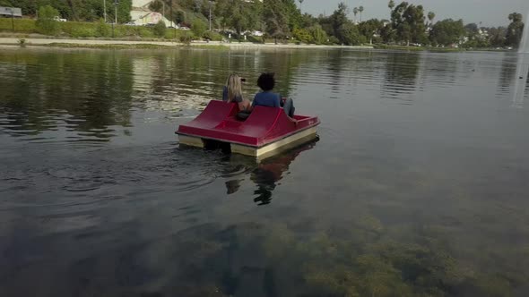 Cute Couple Enjoying A Boat Ride In The Park