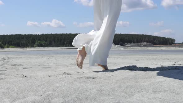 Beautiful Woman Walking on Shore