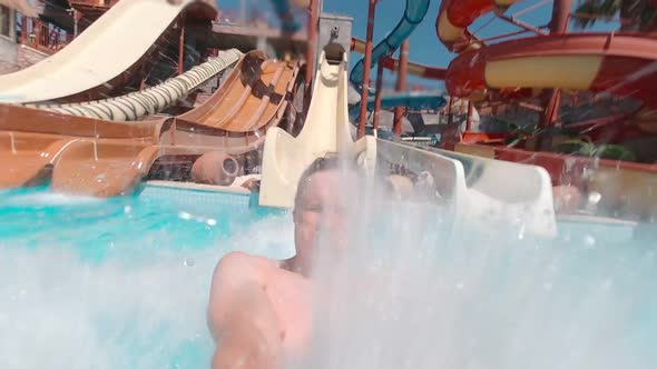 A Man Screaming On A Water Slide