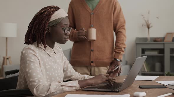 African-American Handicapped Woman Shopping Online