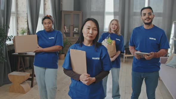 Multi-Ethnic Team of Volunteers in Blue T-Shirts