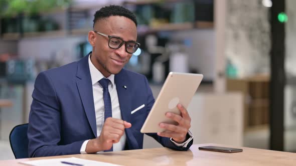 Professional African Businessman Doing Video Call on Tablet