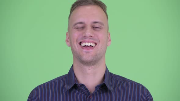 Face of Happy Handsome Businessman Smiling and Laughing