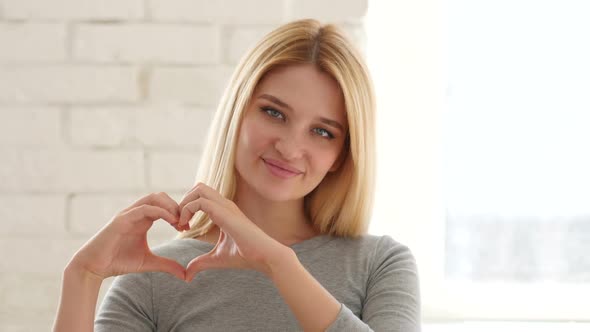 Heart Sign by Young Woman, Hands